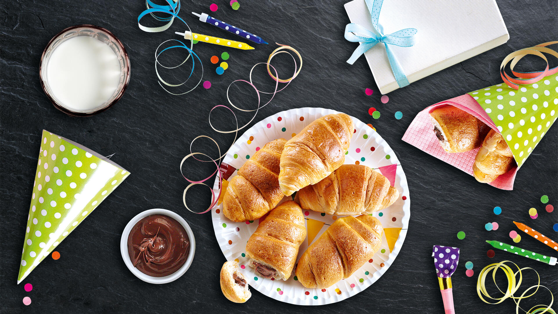 Kinder Croissants Nuss Nougat Créme mit Kerzen, Luftschlangen und Schokocreme
